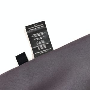 お買取したロクのベルト付プリーツスカート素材表示タグの写真です。